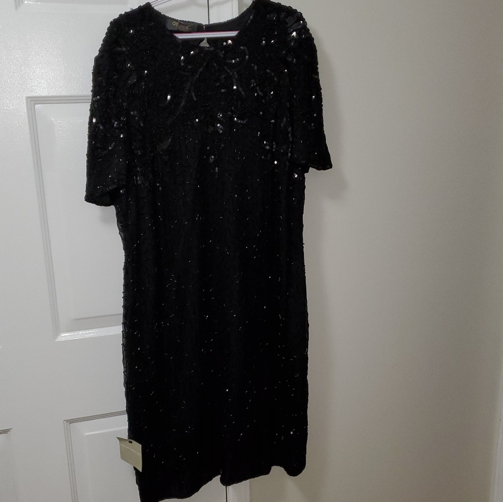 Gorgeous, classic and beaded midi dress.